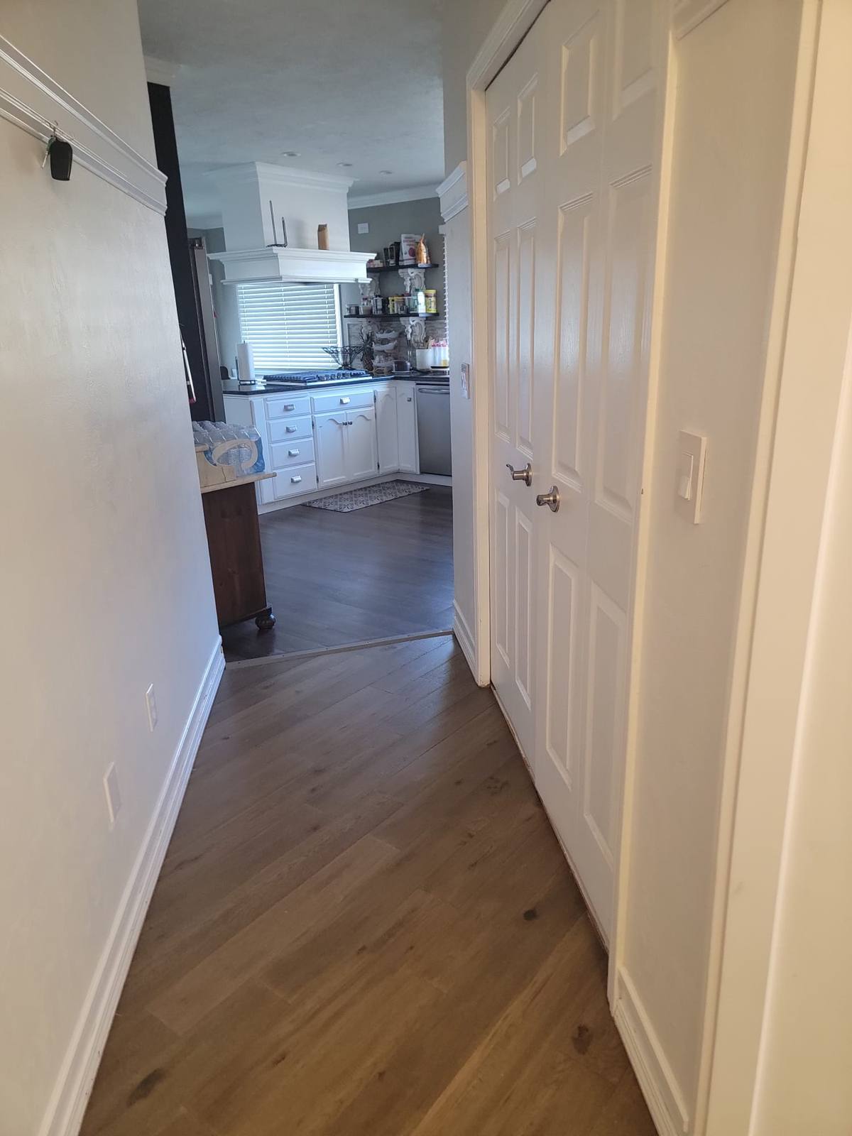 A level hallway running from the bedrooms through to the kitchen.
